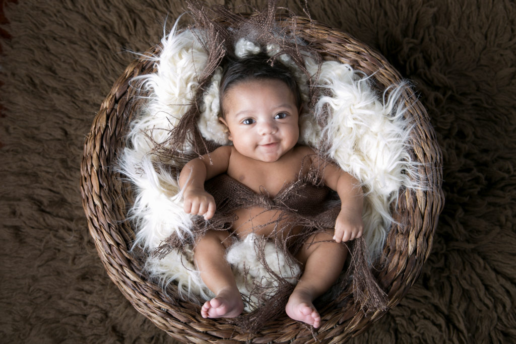 smiling baby basket texture ethnic multi racial boy