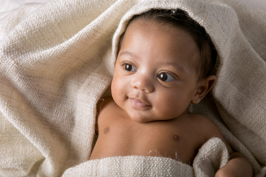 baby boy racial blanket texture big eyes